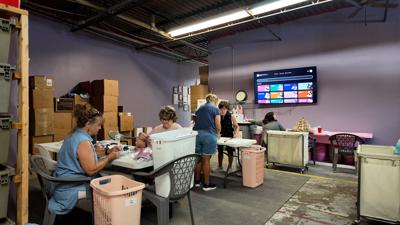 Volunteers working to sort items.