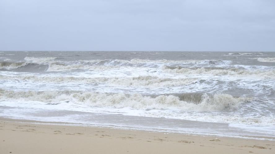 White caps on waves approaching the beach.
