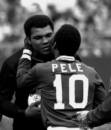 FILE - Soccer player Pele embraces boxer Muhammad Ali during a ceremony honoring the Brazilian soccer star of the New York Cosmos at Giants Stadium, East Rutherford, N.J., Oct. 1, 1977. (AP Photo/Richard Drew, File)