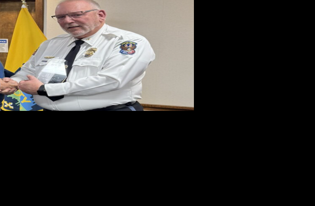 Chief George Bacorn looking at the camera with his uniform on.
