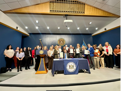Delaware Gov Matt Meyer at a ceremonial bill signing with advocates 
