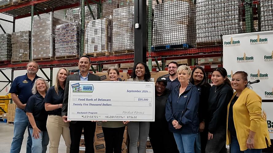 Perdue gifts Food Bank of Delaware with a $25,000 check for their Backpack Program