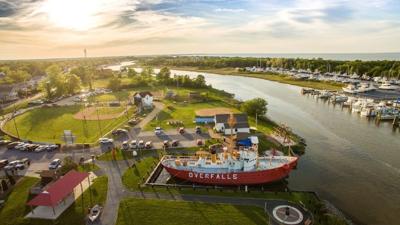 an ariel image of lewes canal front park, looking down at the baseball field and boat docked 