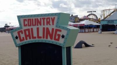 An image of the Country Calling sign located at the beach in Ocean City.
