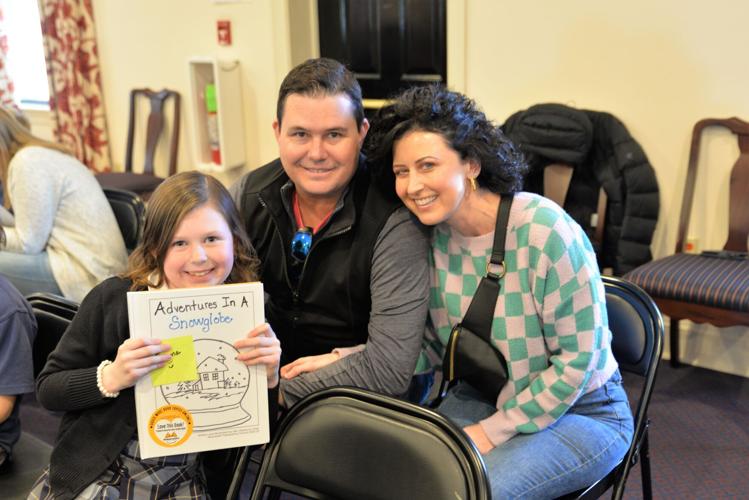 Second grader Emma Abbott from Salisbury was excited to share her story of being trapped in a snow globe with her parents, Lex and Jennifer Abbott. Courtesy Worcester Preparatory School.