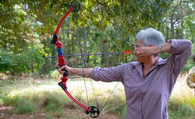 A woman practicing archery.