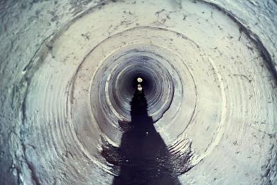 Industrial tunnel. Cement Sewer Pipe. Underground waste system
