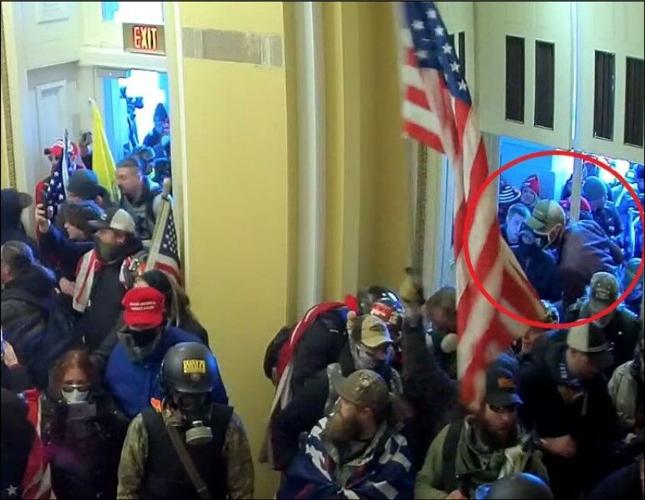 Schaefer seen entering the Capitol through a window in the Senate Wing.