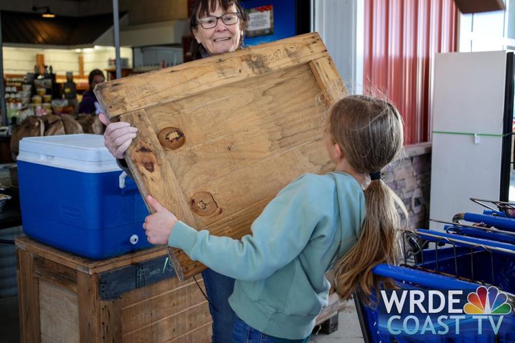 Community members working together Sunday to prepare meals and other help for storm victims.