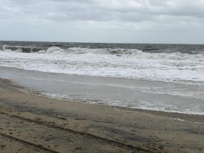 Waves on Rehoboth Beach creep closer to the dune.