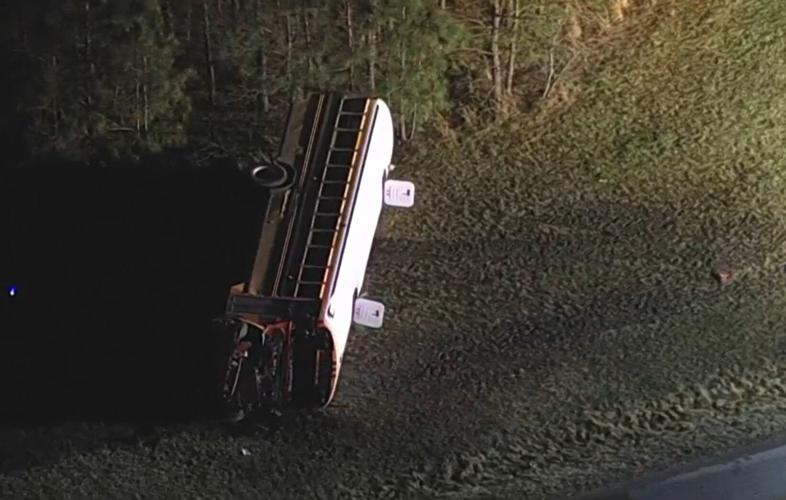 Helicopter footage from NBC10 Philadelphia shows the bus still on its side after students were extracted.