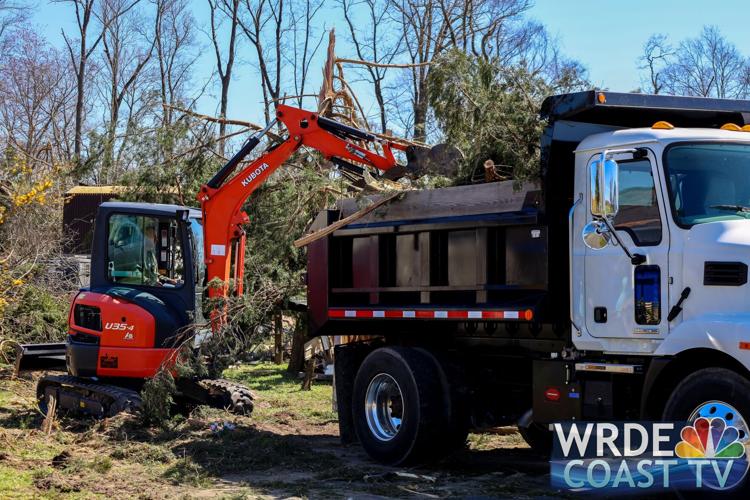 Trucks and heavy machinery were brought in to help clean up properties in Bridgeville, Greenwood, and Ellendale over the weekend.
