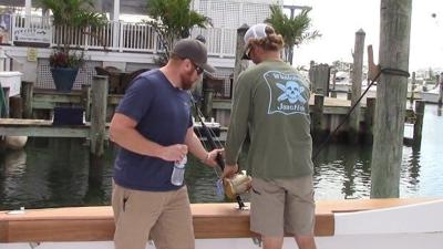 Father and Son Swim with Shark