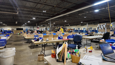 A wide shot of the warehouse at KSI.