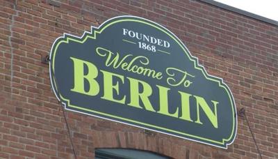A sign welcoming people to the town of Berlin. 