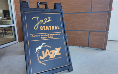 A sign with the Rehoboth Jazz Festival logo on it. 