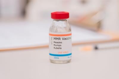 Vial of clear Measles vaccine fluid.