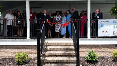 Community leaders and elected officials gather for the ribbon-cutting ceremony at Life Lines South.