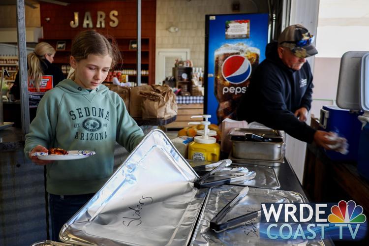 A young girl creating a plate for lunch on Sunday.