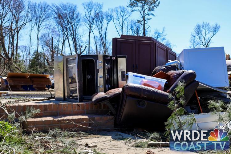 An oven and stove as well as a recliner can be seen among the wreckage.