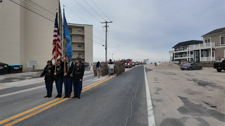 A color guard presenting colors in the middle of a street.