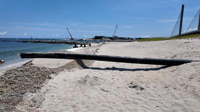A pipe DNREC is using to move sand from the South end of the Inlet to the North end onto the beach