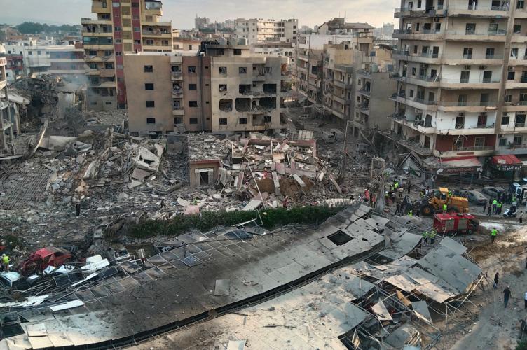 A Lebanese hospital is in ruins and people flee a Beirut suburb after Israel's threat, in photos