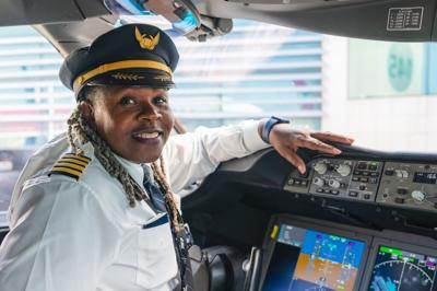 Captain Theresa Claiborne sitting in plane cockpit