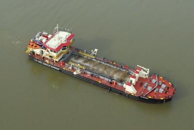A photo of a big red ship called a Murden which is being used by the U.S. Marine Corps of Engineers to begin dredging in Ocean City. 