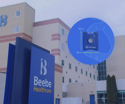 A mockup picture of the button in a circle alongside the Beebe hospital sign.