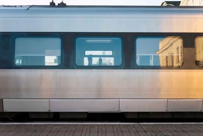 A close up of the side of a passenger rail.