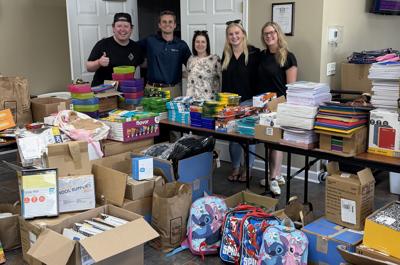 SCAOR Young Professionals Network (YPN) members posing with donations