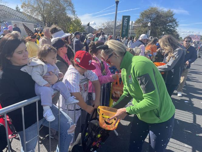 Anchor Madeleine Overturf handing out candy