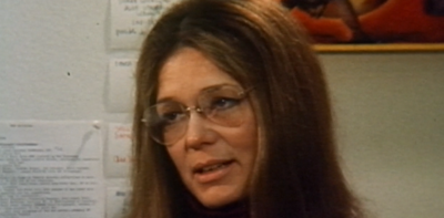 Gloria Steinem mid conversation as a young lady. 