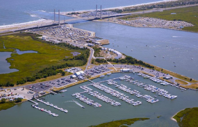 The eastern end of the Indian River Bay with the dozens of boats in slips at the marina. The Inlet bridge as at the top of the photo.