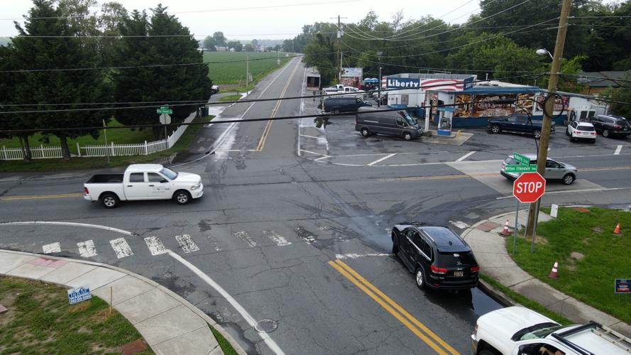Cars at the intersection of Mulberry St and Route 16 in Milton