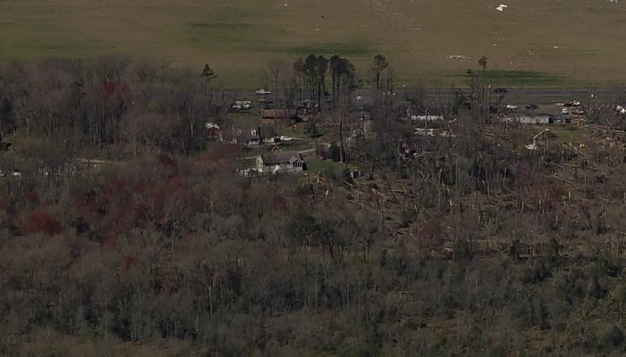 Some helicopter shots over Greenwood and Bridgeville earlier today show a clear path from the tornado demolishing some buildings without touching others nearby.