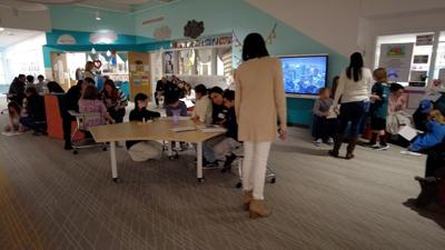 Gathering with family members and school staff, the students showcased their hard work.