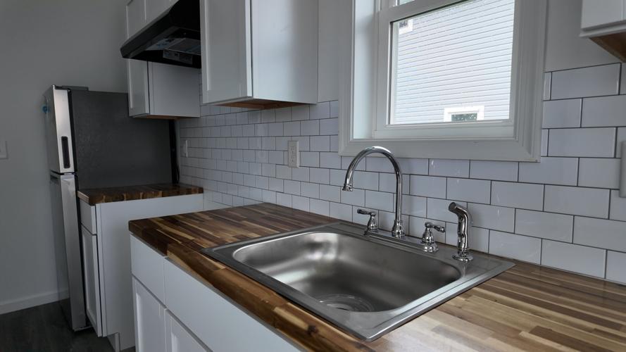 Kitchen area of a one-bedroom cottage home.
