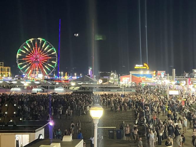 A boardwalk full of people from above.