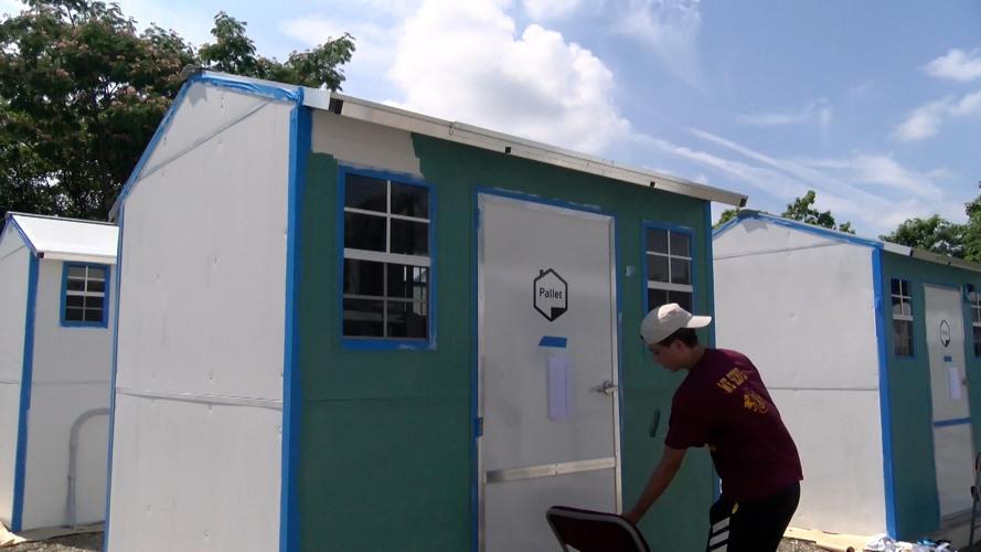 Pallet Village homes get painted