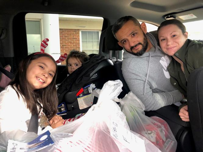 A family that volunteered for Operation Christmas CHEER in the past. Courtesy CHEER Community Center.