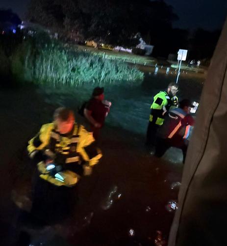 Firefighters assisting the amazon driver.