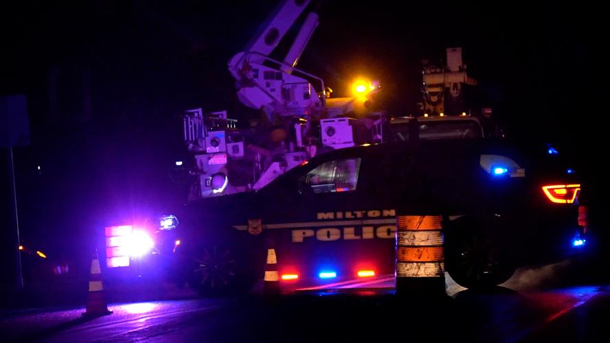 Crews working cops blocking road