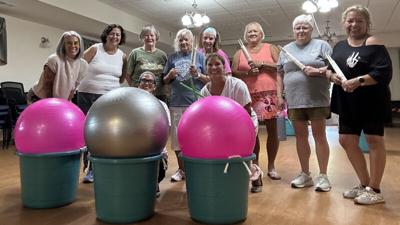 Women from CHEER Academy posing with exercise balls. (CHEER Academy)