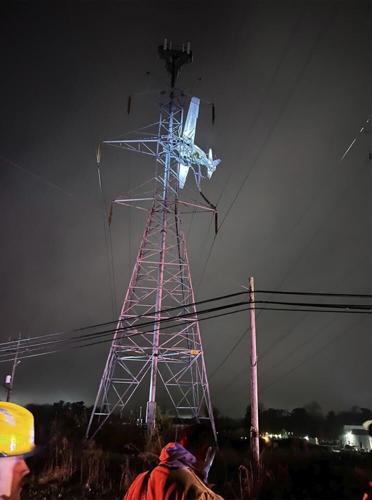 In this photo provided by Montgomery County Fire and Rescue, a small plane rests on live power lines after crashing, Sunday, Nov. 27, 2022, in Montgomery Village, a northern suburb of Gaithersburg, Md. (Pete Piringer/Montgomery County Fire and Rescue vi...