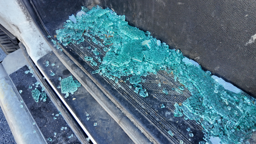 Shattered glass inside Raúl's work van.