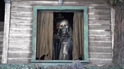 Skeleton looking out from the Haunted Mansion in Finland
