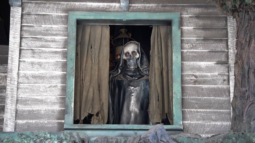 Skeleton looking out from the Haunted Mansion in Finland