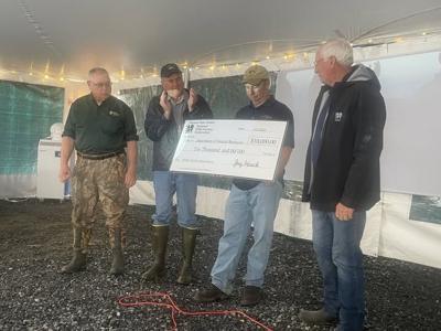 The National Wild Turkey Federation gives check